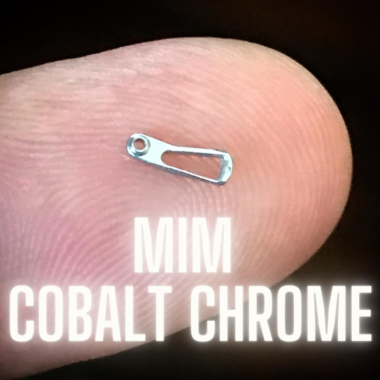 MIM Cobalt Chrome part on fingertip